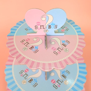 Three-tier gender reveal cupcake stand in pink and blue with Girl or Boy heart topper