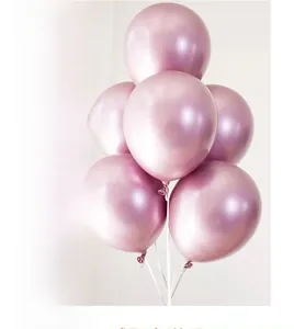 Close-up of metallic pink latex balloons with glossy finish for festive party decorations
