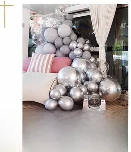 Detailed view of metallic silver and gray latex balloons with confetti for party decor