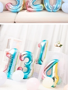Close-up of vibrant gradient rainbow number foil balloons for birthday party decor