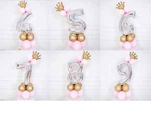 Silver number foil balloon pillar with golden crown and pink party balloon base
