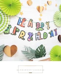 Detail of dinosaur Happy Birthday banner with colorful cartoon patterns and paper cutouts