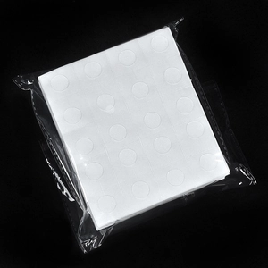 Portable white adhesive glue dots for balloon decoration in clear plastic packaging