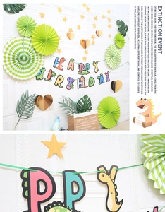 Cartoon dinosaur happy birthday banner set with paper fans and green party decorations