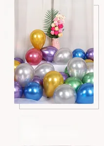 Close-up of vibrant metallic latex balloons in gold silver and purple for party decor