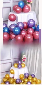 Close-up of assorted metallic latex balloons in gold, blue, and burgundy for party decor