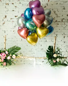 Macro shot of chrome metallic heart balloons with vivid colors and glossy texture for party