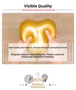 Close-up of golden metallic heart balloon being squeezed to show high elasticity and durability