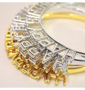 Macro detail of Happy Birthday hollowed letters on gold and silver metallic headbands