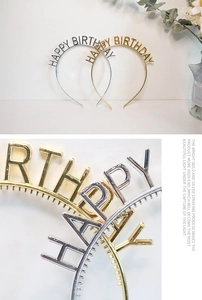 Macro detail of gold and silver Happy Birthday headbands with metallic finish