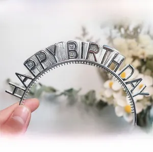 Macro detail of silver Happy Birthday headband featuring small non-slip inner teeth