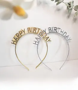 Detail showing gold and silver Happy Birthday headbands with metallic finish