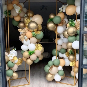 Detail of olive and avocado green balloon arch with gold frame for party decor