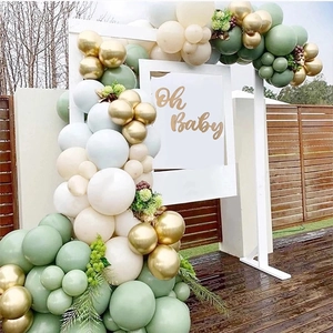 Balloon arch detail featuring olive green, cream and gold tones for Oh Baby party decor