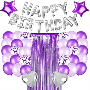 Macro detail of purple tinsel foil fringe curtain for birthday party decoration set