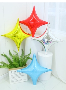 Detailed close-up of metallic four-pointed star foil balloons in red, silver, gold and blue