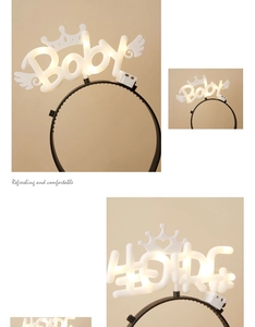 Detail of LED Happy Birthday crown headband with warm white glow and angel wings decor