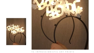 Detail of LED light-up birthday headband with Baby text and crown decoration