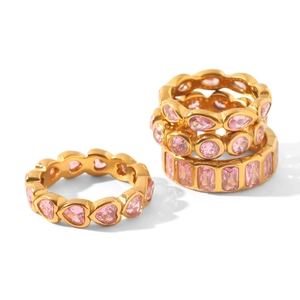 Detailed macro view of high-quality gold plated titanium steel rings with pink zircons