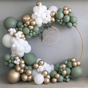 Detail of avocado green and gold balloon arch kit for elegant party decoration