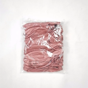 Uninflated rose gold latex balloons in clear plastic packaging with safety warnings