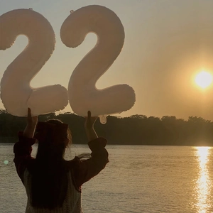 40-inch cream white number 22 foil balloon for birthday parties held in scenic outdoor setting