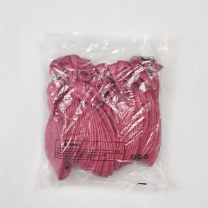 Detail of bulk rose red matte latex balloons in clear plastic packaging with safety labels