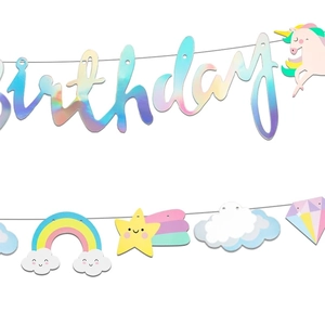 Close-up of laser iridescent birthday banner with unicorn and rainbow party decorations