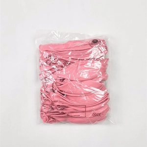 Uninflated matte pink latex balloons in clear bulk packaging with CE safety labels
