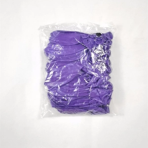 Detail of bulk purple latex balloons in transparent sealed retail bag with CE marking