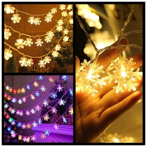 Detailed macro view showing the snowflake LED string lights with warm white and colorful glow
