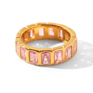 Macro view of a gold-plated titanium steel ring set with radiant pink cubic zirconia stones
