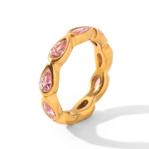 Close-up of gold-plated stainless steel ring with pear-shaped pink zirconia stones.