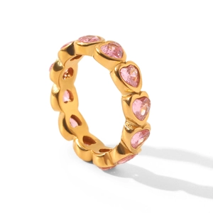 Macro view of gold-plated titanium steel ring set with pink heart-shaped zircon stones