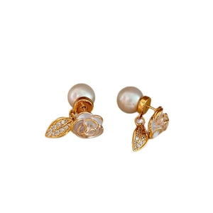 Elegant gold camellia flower earrings with lustrous pearls and sparkling zircons