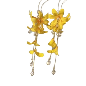 Vibrant yellow fabric flower earrings with long metallic tassels for beach holiday style