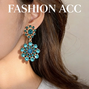 Vintage style gold-tone earrings featuring blue crystal floral dangle design for women
