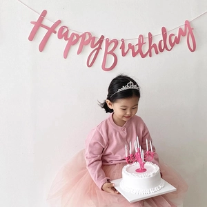 Pink candelabra cake topper with Happy Birthday banner and tiara for kids' party decor