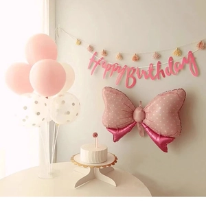 Pink Happy Birthday banner set with polka dot bow and latex balloons for party decoration