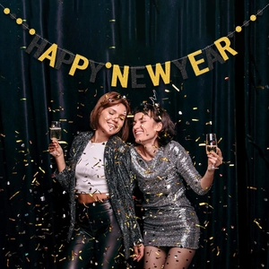 Glittery gold and black Happy New Year banner for festive party background decoration
