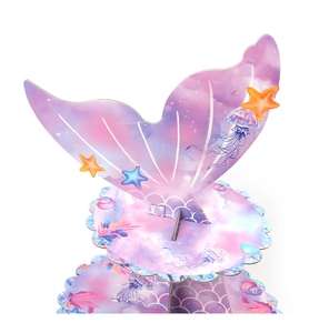 Detail view of mermaid tail cupcake stand with purple scales and scalloped sea edges