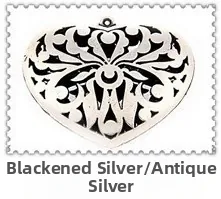 Detalle de colgante de corazón de plata antigua calada para creación de joyas DIY