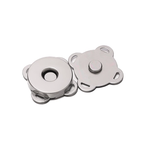 Macro detail of plum blossom magnetic snap fasteners for bags with four sewing holes