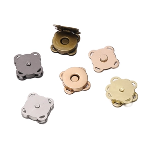 Detailed view of various metallic magnetic sewing buttons for bags and clothing