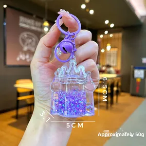 Detailed size view of purple castle liquid sand keychain with stars and measurements