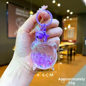 Detail of purple bear liquid sand keychain showing dimensions 5cm and a cute bell