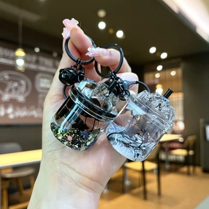 Luminous iceberg cup keychain charms with flowing sand and dried purple flowers