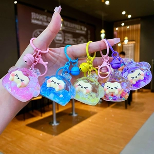 Five colorful cartoon bear keychains with liquid sand effect and small bells in hand