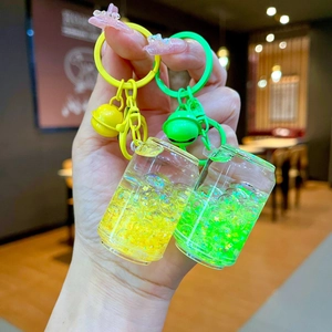 Luminous beverage can keychains with yellow and green liquid sand and star sequins