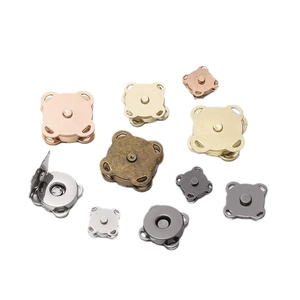 Assorted electroplated plum magnetic snap buttons in gold, silver and bronze for bags